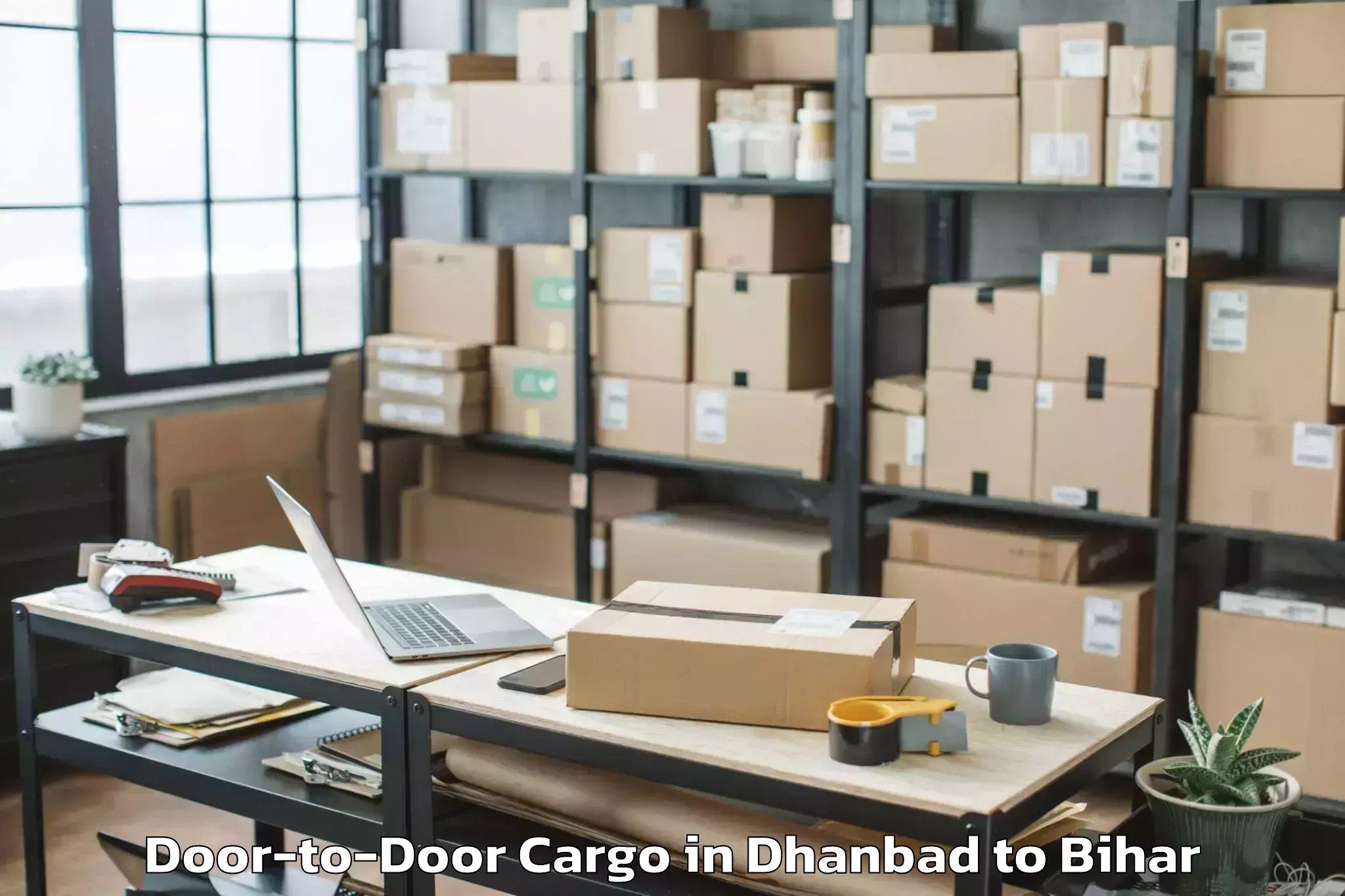 Reliable Dhanbad to Lauria Nandangarh Door To Door Cargo